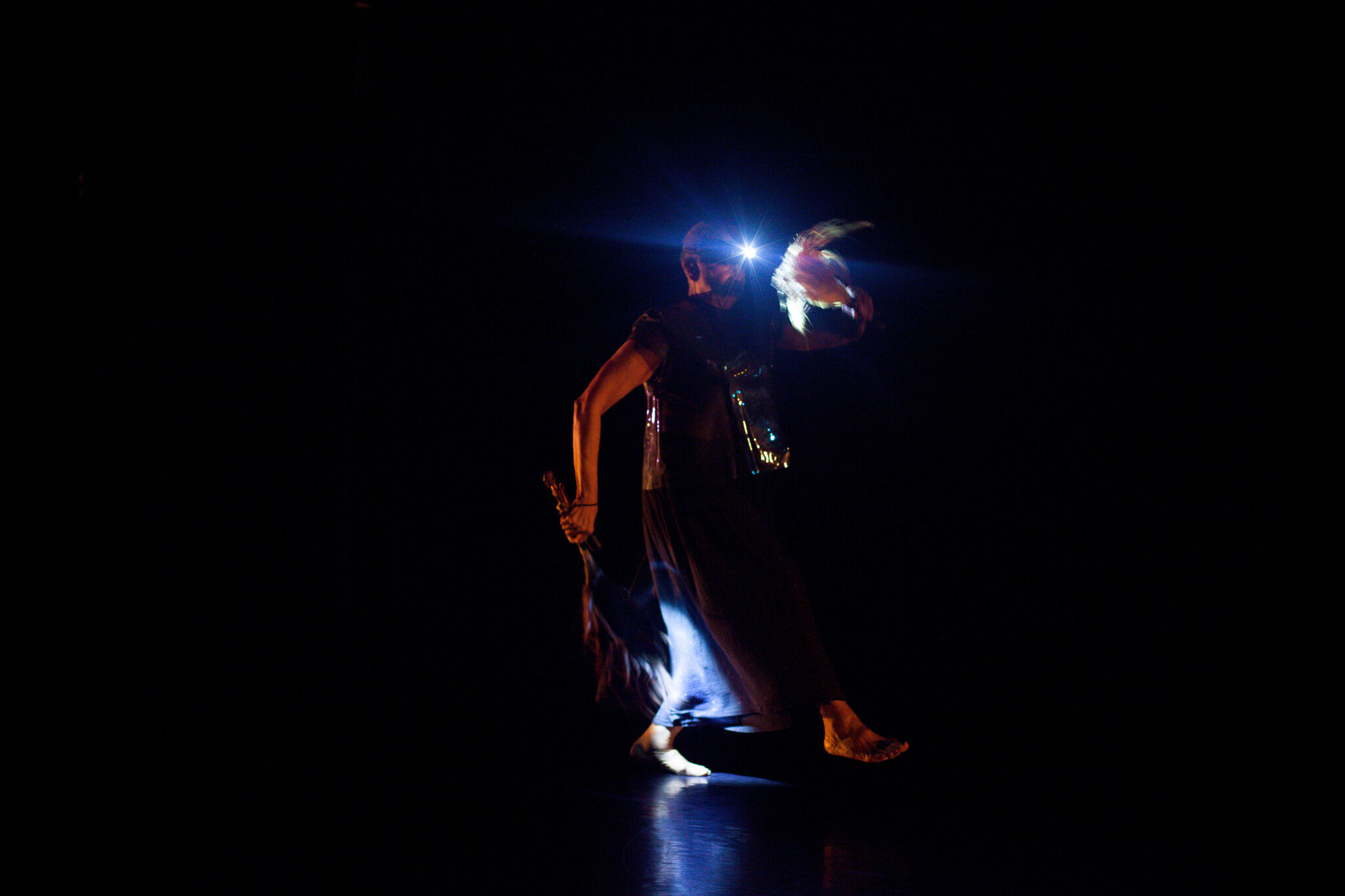 Performance in dark gallery.