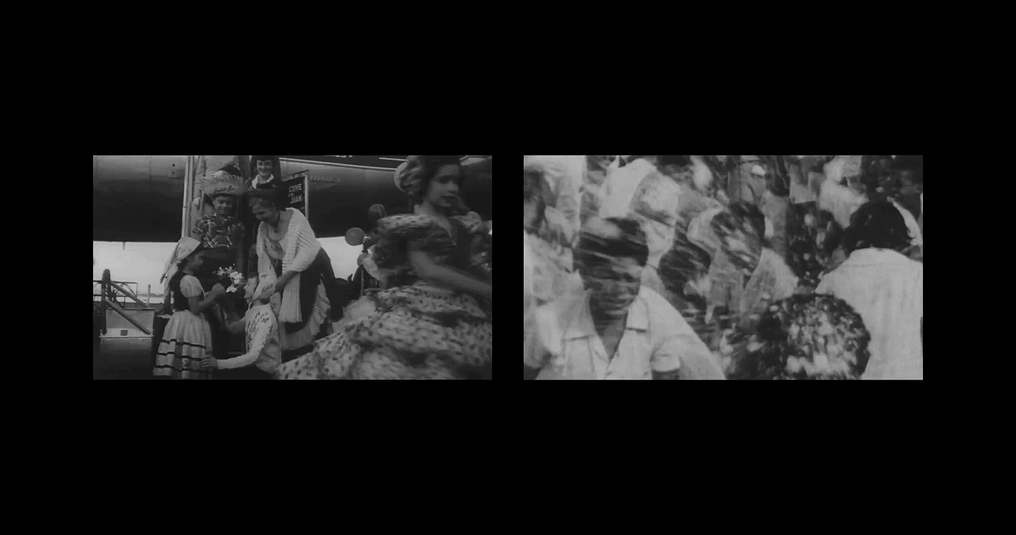 A black-and-white video still of a split screen with one side featuring people standing on the stairway to a plane and the other featuring a blurry crowd of people.