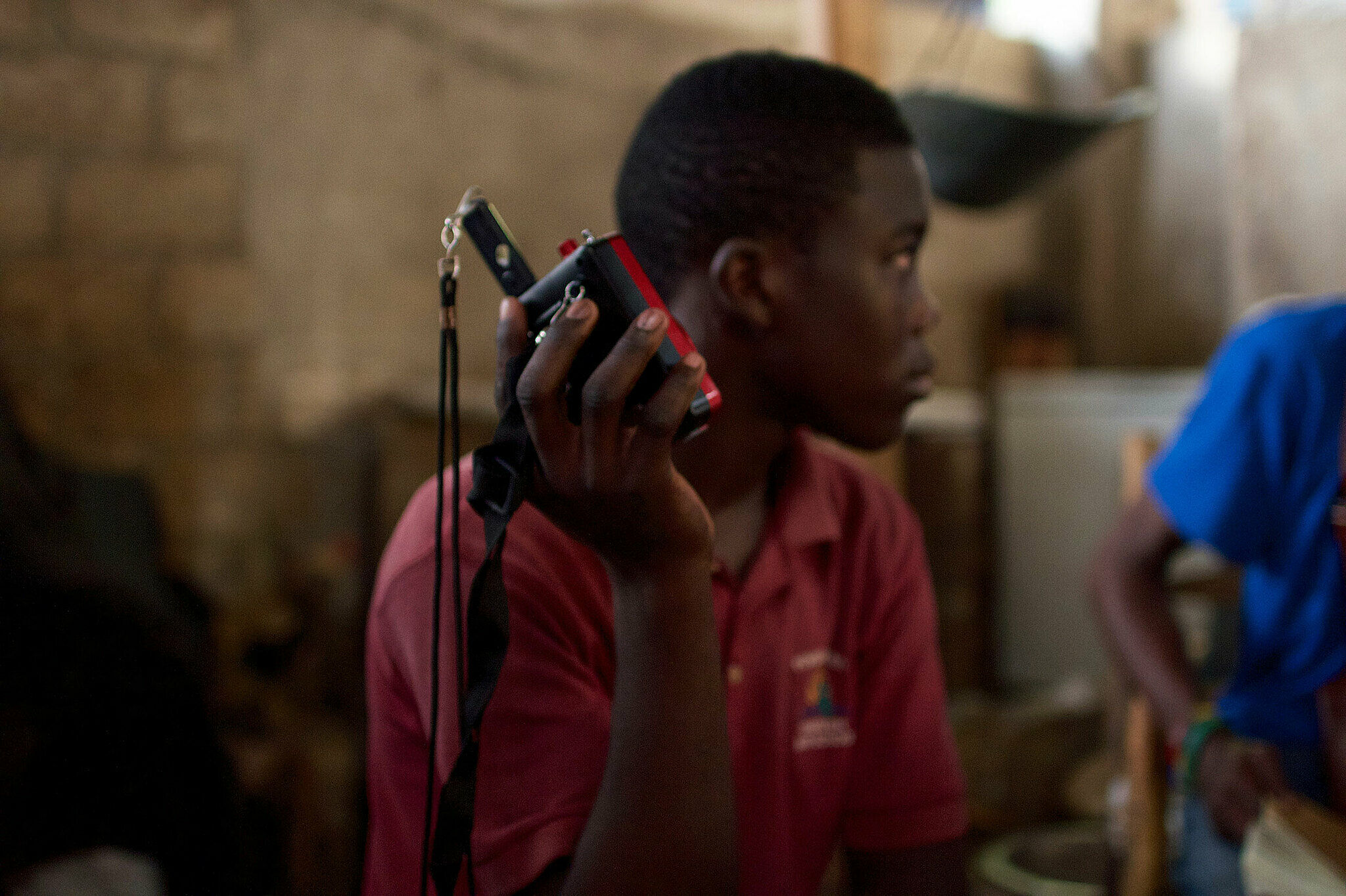 Young man holding electronic device