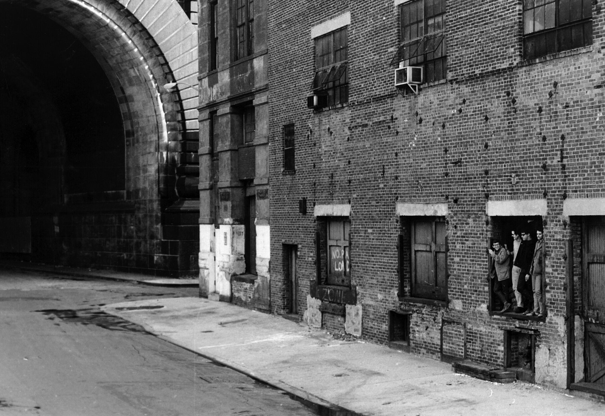 Ron Clark and three students in the doorway of the first ISP space on Cherry Street.