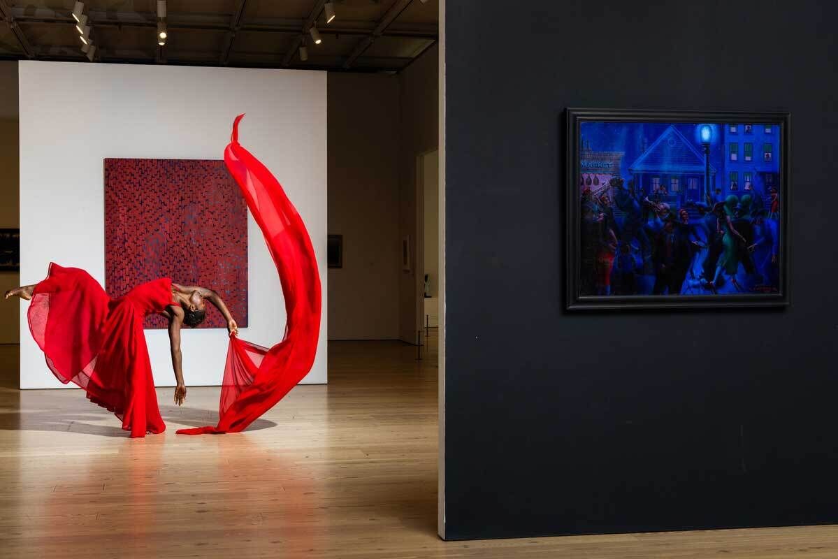 At left, a dancer in a red dress leans back pulling red fabric in an arch above her body. At right, a blue painting of a lively evening jazz performance.