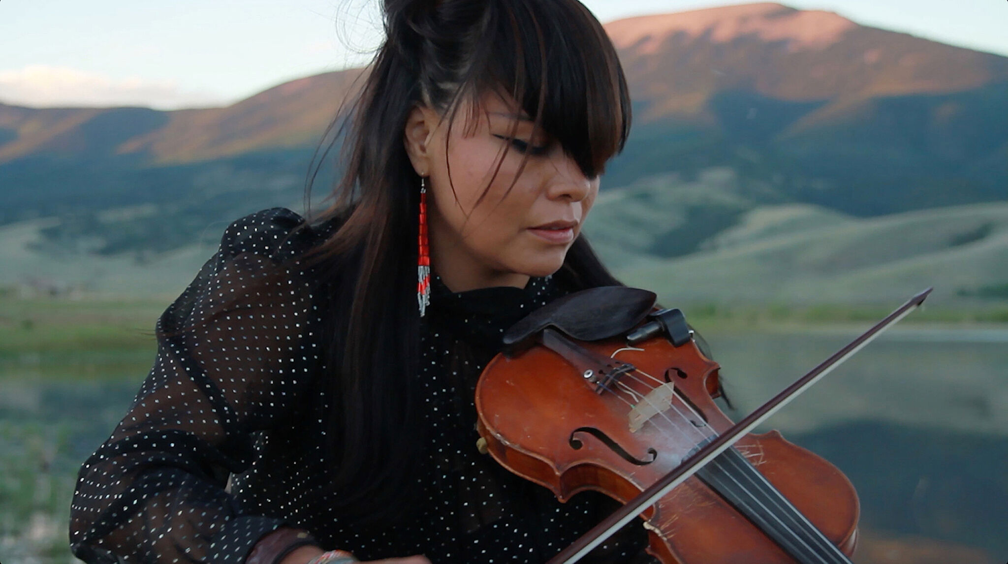 A photograph of a woman playing violin