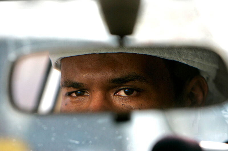 A still from a video of a driver through the rear-view mirror. 