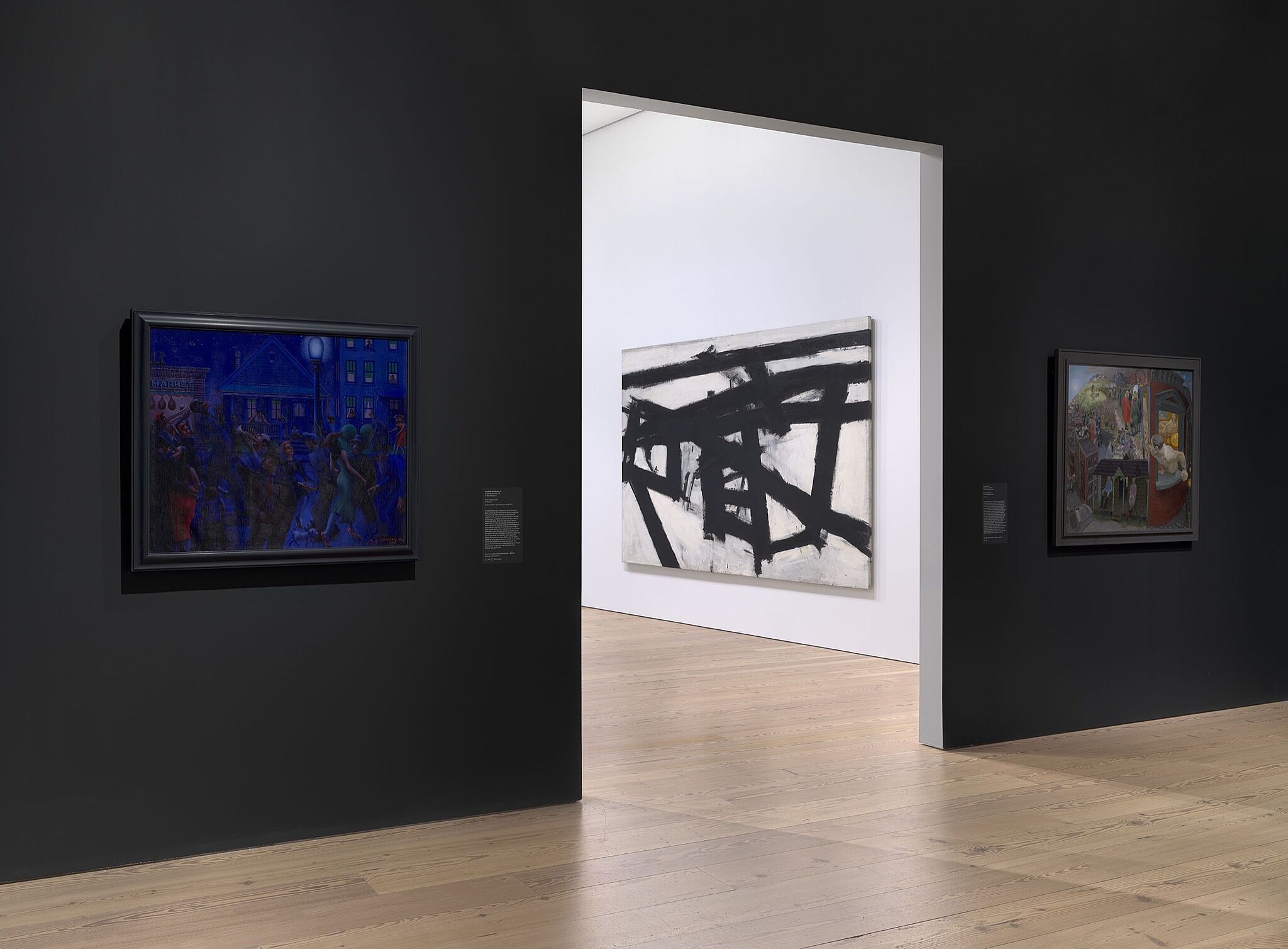 An image of the Whitney galleries with paintings on the wall